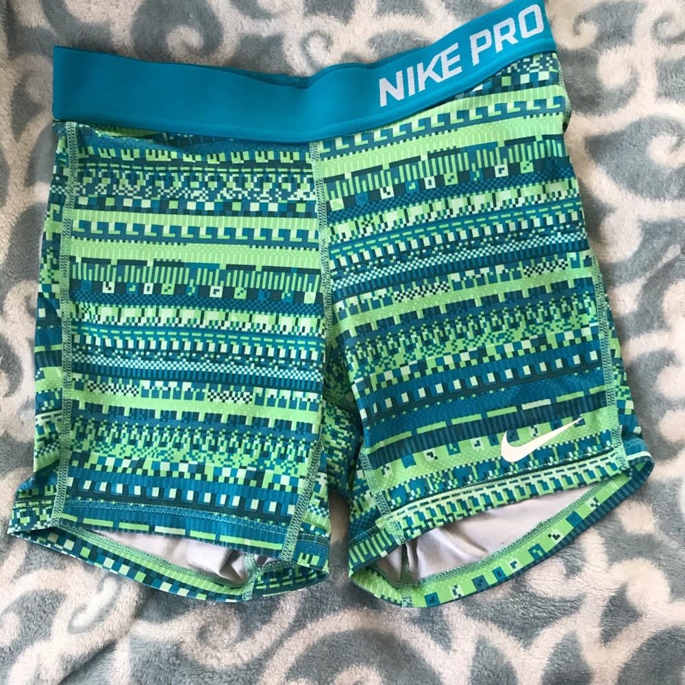 Nike pros little girls L. Can fit an adult XS or S
